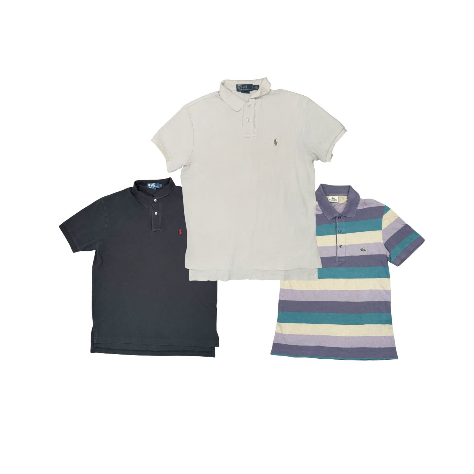 Three vintage piqué polos laid flat on white: a faded navy Ralph Lauren with a red pony, a cream Ralph Lauren, and a Lacoste striped in teal, lilac and cream.